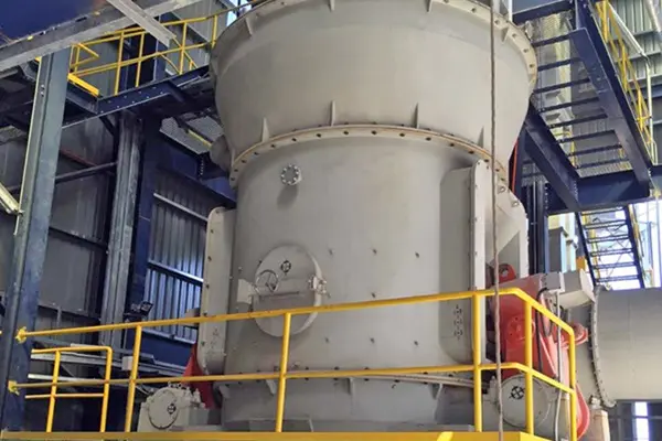 Vertical grinding mill processes talc